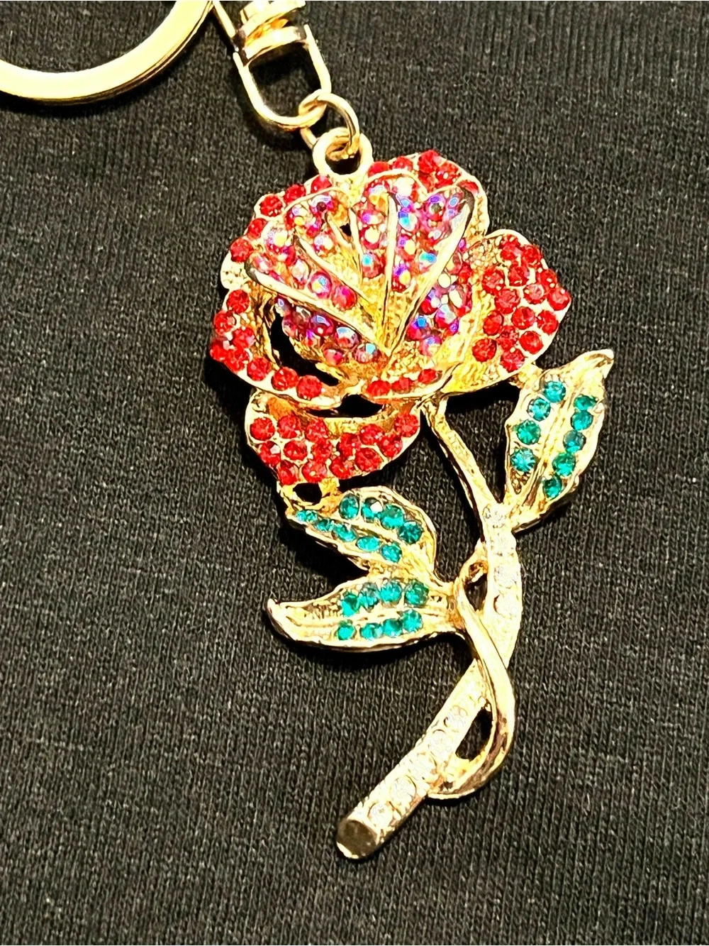 Gold-Tone Rose Bag Charm with Red Crystal Petals and Teal Leaves.       NWT